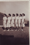 Alicia and friends in white Navy uniforms.