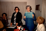 Woman Holding Up Certificate, February 27, 1980