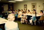 Women Sitting Around Tables