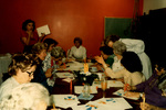 Women Coloring Paper At a Table