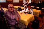 A Man And Women Sitting At a Table