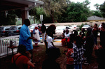 Children Surrounding a Mascot