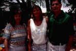 Three People Pose Outside For a Photo