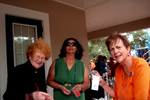 Three Women Holding Up Paper Tags