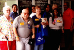 Group of People Posing For a Photograph Outside of a School