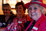 Three Women Pose For a Photograph