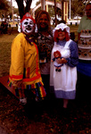 Woman Poses For Picture With Two Women In Costume