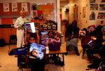 Children Holding Up Books