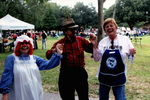 A Raggedy Ann, Man In Plaid And Altrusa Volunteer Pose For Photograph