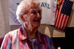 Woman Standing Infront of American Flag