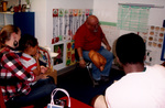 A Man In a Classroom Speaks To Children