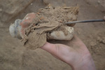Excavating a Figurine Offering Found in R12