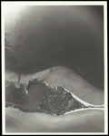 A close aerial view of an unknown island and surrounding waterways