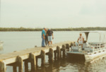 Small Boat at Dock with National Audubon Society by Richard T. Paul