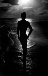Silhouette of a person standing on a Florida beach by Bobby Smith and Rex Maniscalco