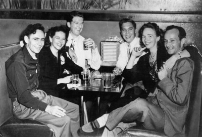 Mary VanderWall and her friends seated in a booth