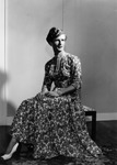 Draq queen posing in a floral dress by Bobby, 1923-2008 Smith