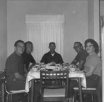 Kay Thompson and friends at a dinner table