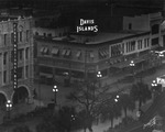 400 and 500 Blocks of Franklin Street at Dusk, Showing Illuminated "Davis Islands" and "First National Bank" Signs, January 15, 1925 by Burgert Brothers