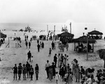 Crowd of people on Treasure Island's Sunset Beach at sunset by Burgert Brothers