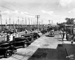 Cars Parked in Front of the Sponge Fleet in Tarpon Springs, Florida by Burgert Brothers