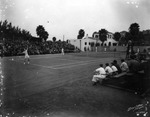Dixie Tennis Tournament with spectators in stands at Davis Islands Tennis Club by Burgert Brothers