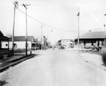Looking north on 19th Street at Ybor City Station and railroad crossing by Burgert Brotheres