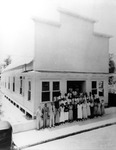 Employees Standing in Front of Afro-American Life Insurance Company Building at 707 East Constant Street
