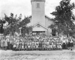 Group of young church members, with adults, in front of Oak Park Baptist Church at 4901 East 10th Street by Burgert Brothers