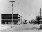 Tampa's 6th Avenue, with the Imperial Cafe on the left by Burgert Brothers