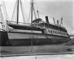 The ferry boat the Favorite on dry land after the hurricane of 1921 by Burgert Brothers