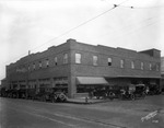 The Strickland and Wisdom Ford Dealership on Broadway Avenue by Burgert Brothers