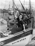 Young Woman Posed on the Bow of the Sponge Boat Socrates in Tarpon Springs, Florida by Burgert Brothers