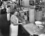 Women Placing Labels on Cigar Boxes at the Sanchez and Haya Company Factory by Burgert Brothers