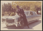 Cleveland Johnson leaning against a car