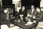 Cesar Gonzmart in Discussions with Colleagues by Unknown