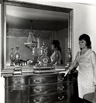 Adela Gonzmart poses with antique furniture
