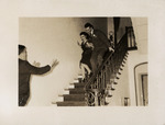 Cesar and Adela Gonzmart Descend the Stairs in a Moment of Celebration by Unknown