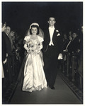 Cesar and Adela Walk the Aisle at Their Wedding by Unknown