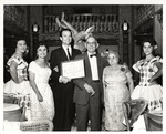 Adela and Cesar Gonzmart with Casimiro Jr. and Carmen Hernandez Celebrating the 1962 Holiday Magazine Award in the Columbia Restaurant's Patio Room by Unknown