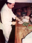 Chef Vincenzo "Sarapico" Perez Preps in the Kitchen by Unknown