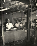 Workers in the Columbia's kitchen before its first upgrade