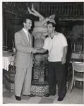 Heavyweight Boxing Legend Rocky Marciano and Cesar Gonzmart in the Patio Room at the Columbia Restaurant by Unknown
