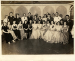 Young dancers pose for a photograph, with Adela Gonzmart seated, second from right