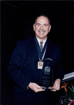 Richard Gonzmart holds the Tampa Bay Business Hall of Fame Award
