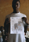 Darfuri boy holding a drawing.