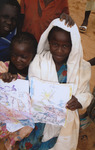 Displaying drawings of attacks in Darfur