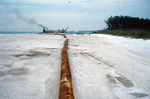 Dredge in New Pass and pipe on Longboat Key by Richard A. Davis and University of South Florida -- Tampa Library