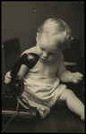 Baby Holding Phone by Hampton Dunn