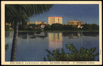 Night Scene of Suwannee Hotel and Mirror Lake Park - St. Petersburg, Florida by Hampton Dunn